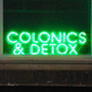 neon signs for three companies in the Natural View Market